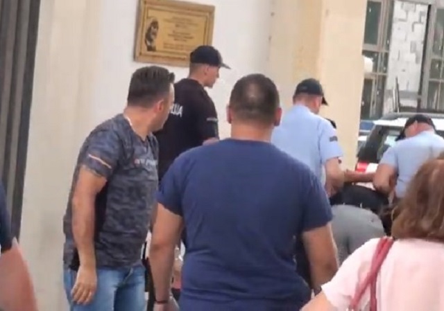 Police brutally arrests elderly Macedonian American to make way for US military vehicles