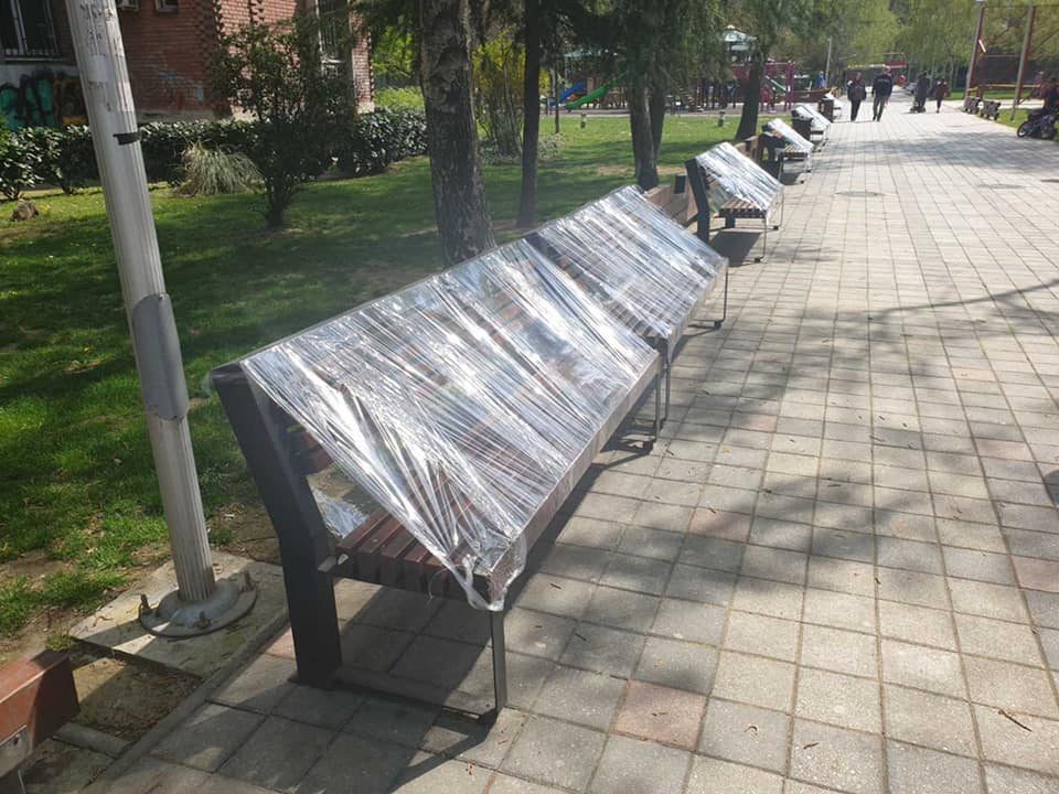 Skopje municipal authorities wrap benches in plastic to prevent citizens from spending time outside
