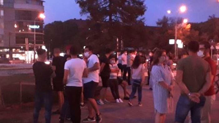 People gather in front of Universal Hall to protest against announcements for its demolition