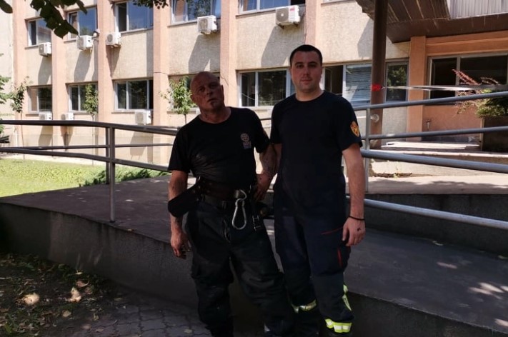 Firefighters remain on guard in the Kumanovo courthouse, where the archives were destroyed in a fire