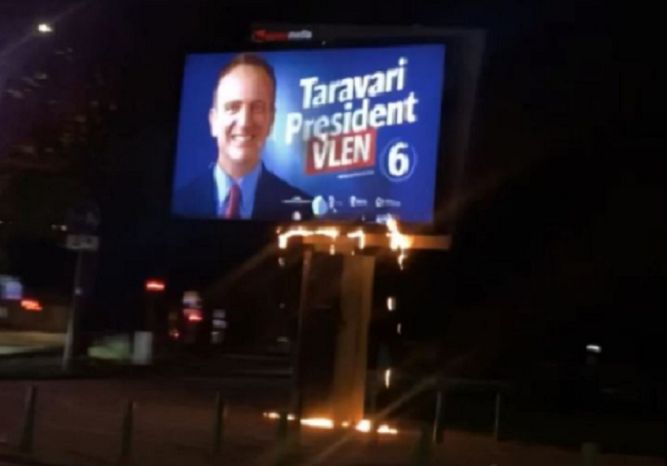 Burning billboard of the presidential candidate Arben Taravari in the center of Skopje