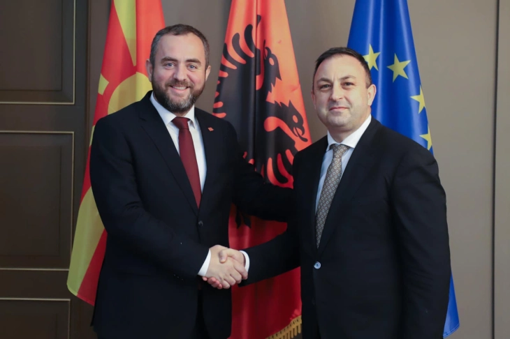 Toshkovski, the interior minister, meets Hoxha, his colleague from Albania